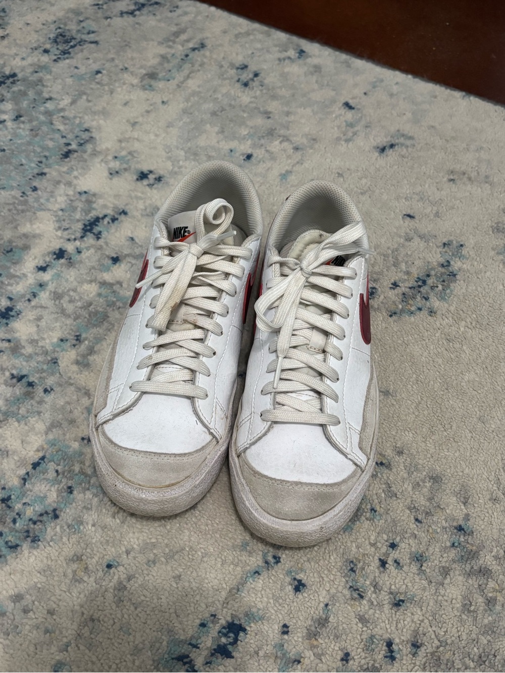 Nike White Sneakers with Red Swoosh Accents